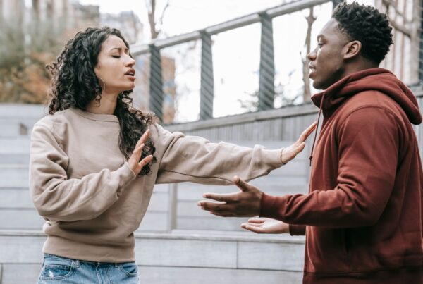 A couple having a difficult conversation outdoors
